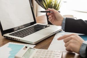 businessman with laptop calculator office