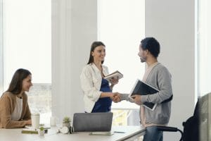pregnant woman having meeting with her coworker
